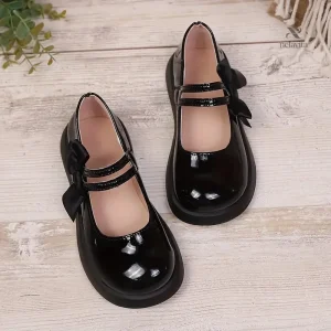 Ballerines noires avec détails en vernis et nœud
