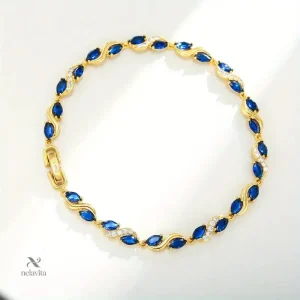 Bijou raffiné en or avec détails en cristal bleu