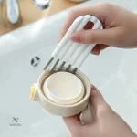 Brosse compacte pour le nettoyage de l'électronique portable