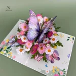 Carte pop-up 3D de vœux avec papillon et fleurs colorées