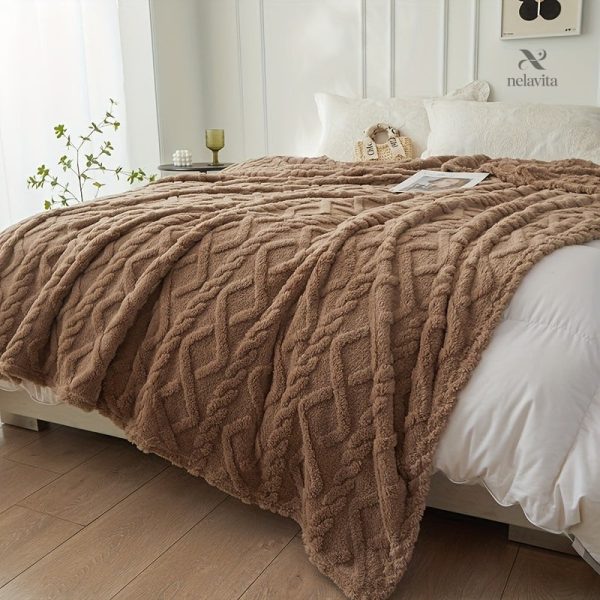 Couverture jacquard, confort et esthétique réunis