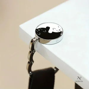 Crochet de Table Pliable Design Chats Yin Yang pour sac à main
