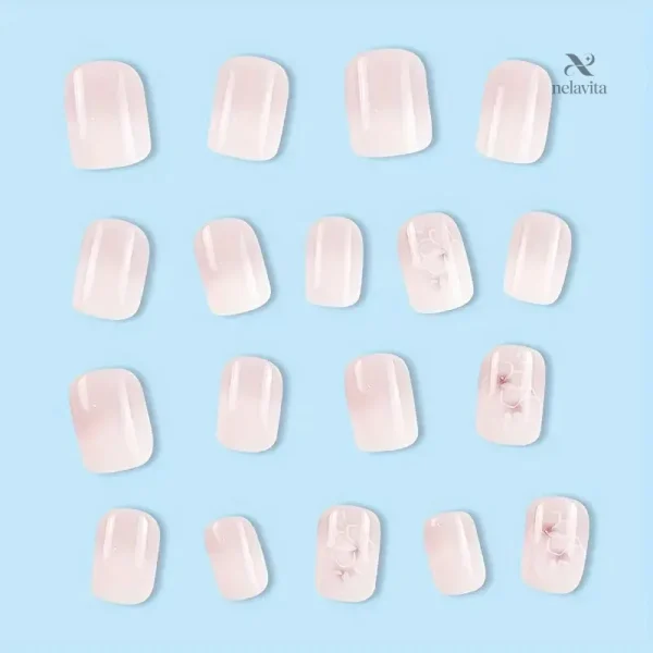 Faux ongles élégants roses avec design floral en relief