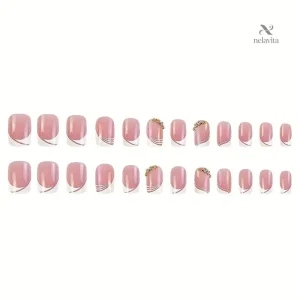 Faux ongles rose nude avec design blanc et strass