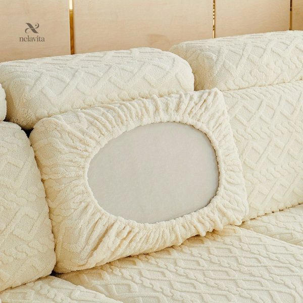 Housse extensible pour un canapé à motifs géométriques