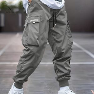 Pantalon cargo style décontracté avec plusieurs poches, ceinture à cordon