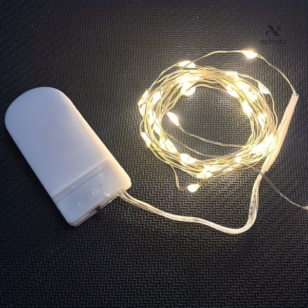 Décoration lumineuse en fil cuivré