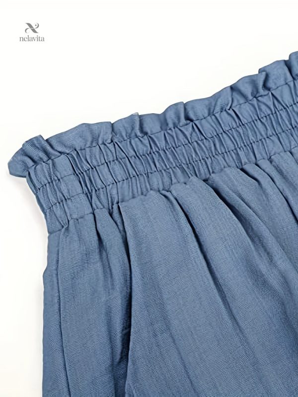 Style raffiné : short taille haute avec détails en dentelle